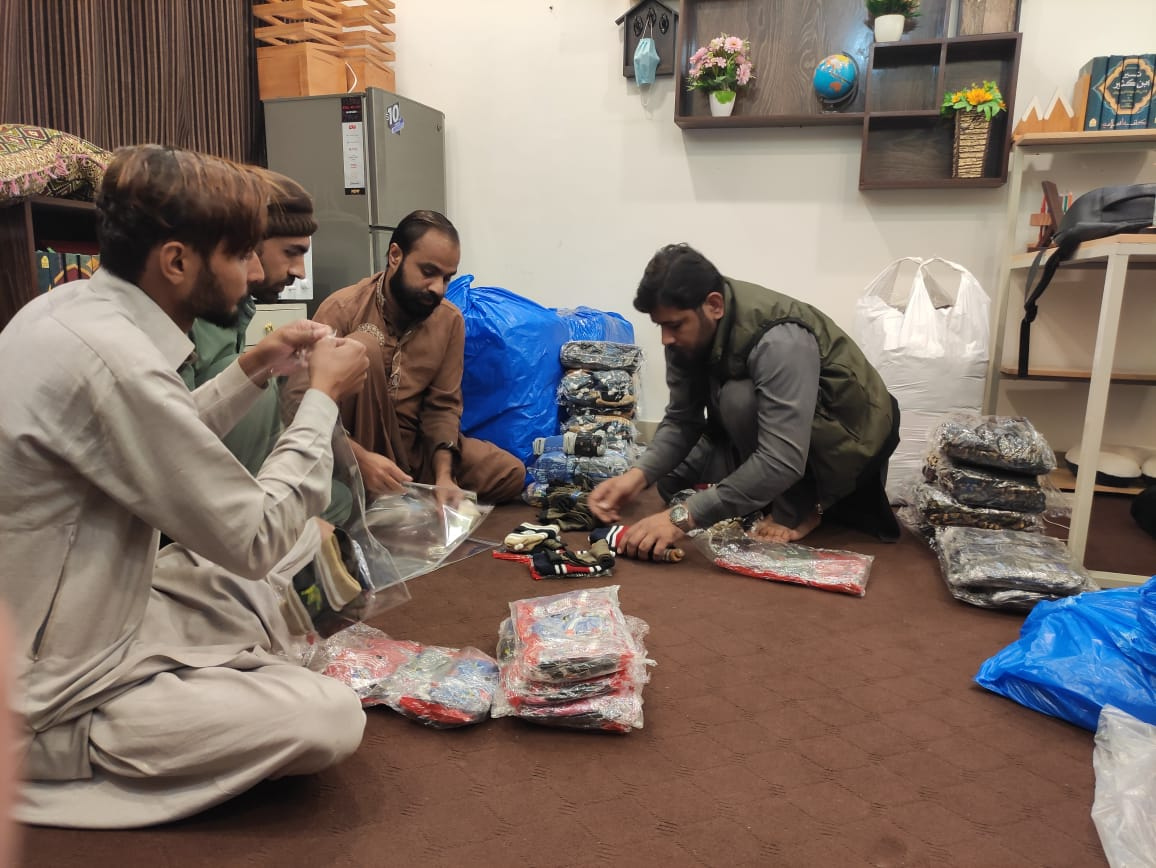 Volunteers packing winter gift packages
