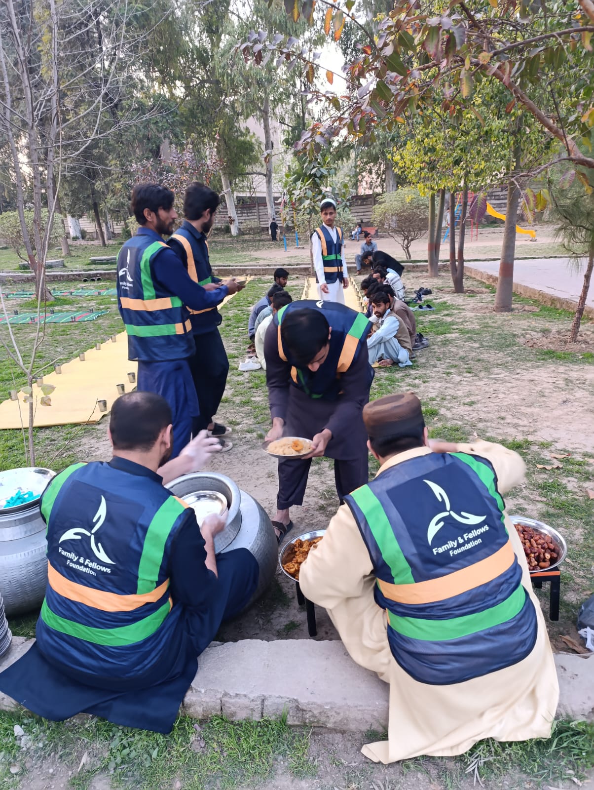 Volunteers serving iftar at a community dastarkhawn